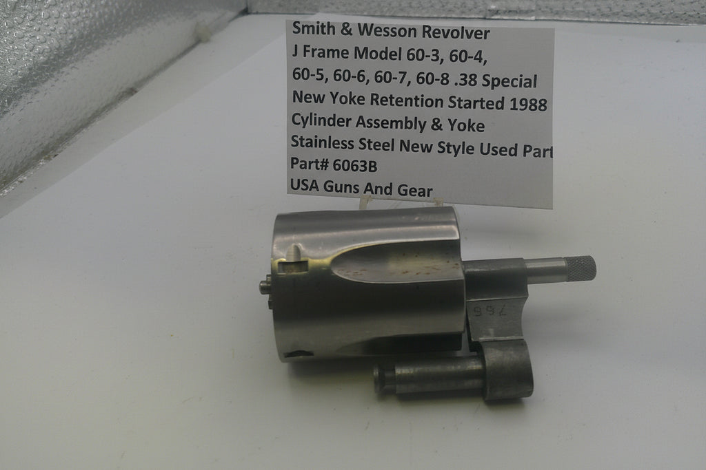 Smith & Wesson revolver part on a white background with a label