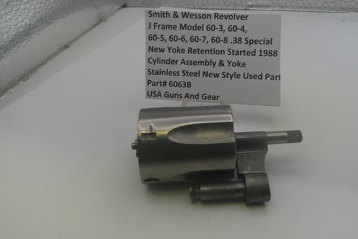 Smith & Wesson revolver part on a white background with a label