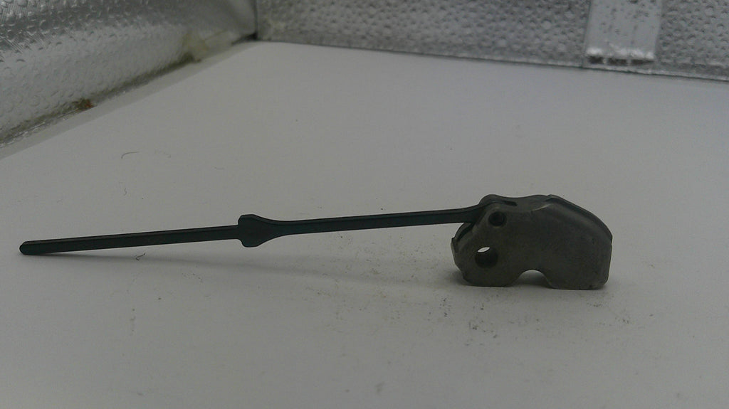 Black wiper blade on a white surface with a textured background