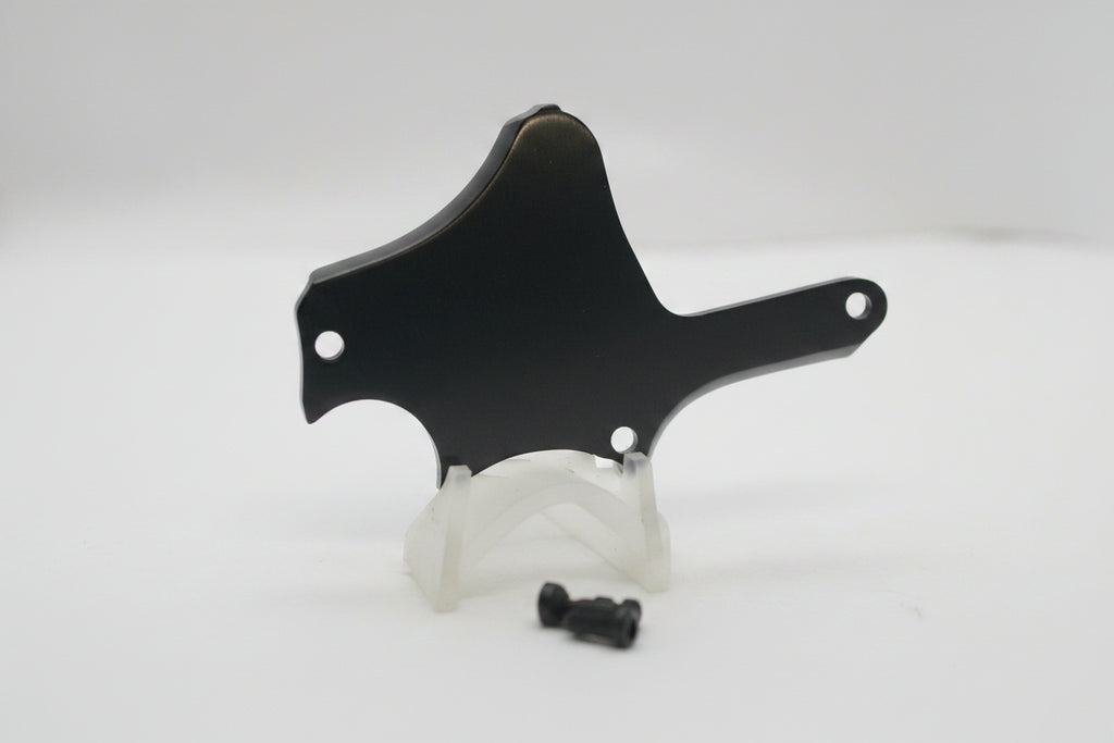 A black metal mounting bracket or shield with pre-drilled holes, shown on a plain white background.