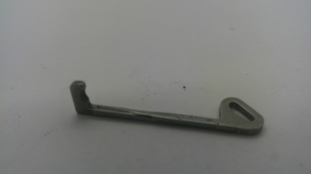 A small gray plastic or metal hook-like hardware piece with a looped end, photographed on a plain light background.