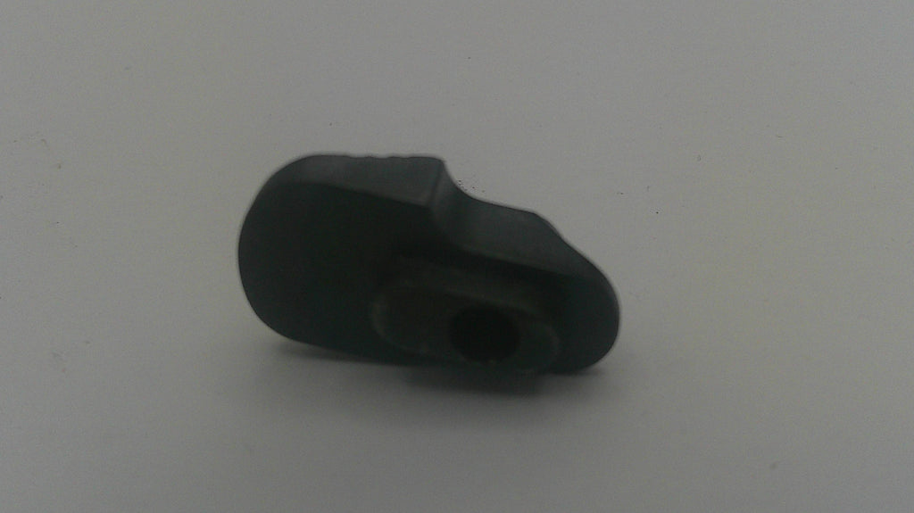 A small black plastic component or adapter with a central hole, photographed on a plain light gray background.