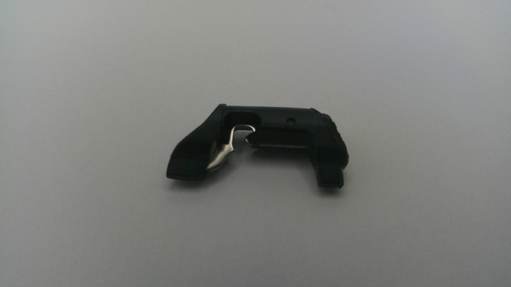 Black plastic clip on a light gray background