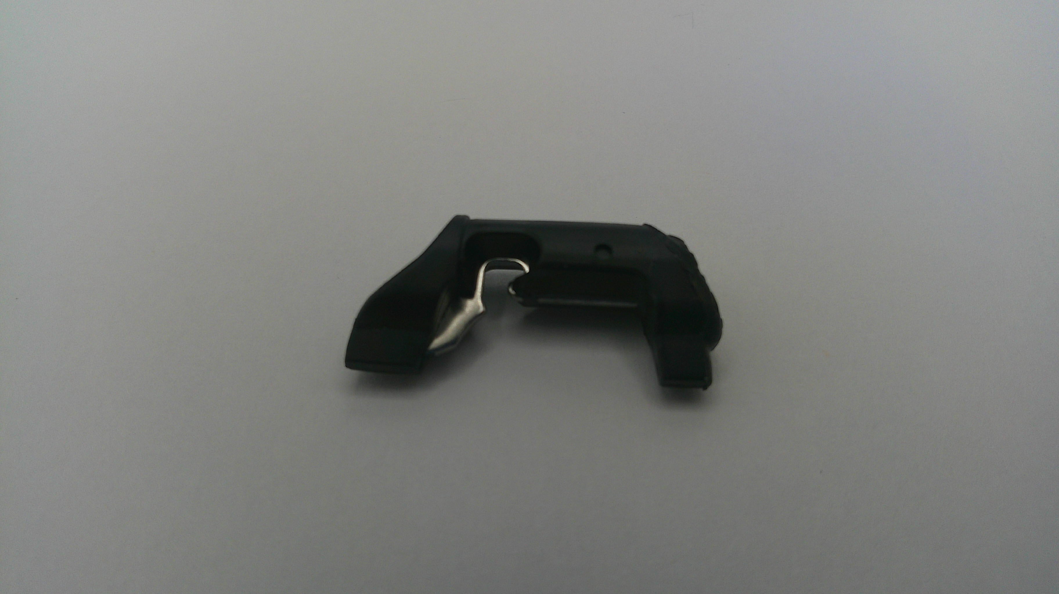 Black plastic clip on a light gray background