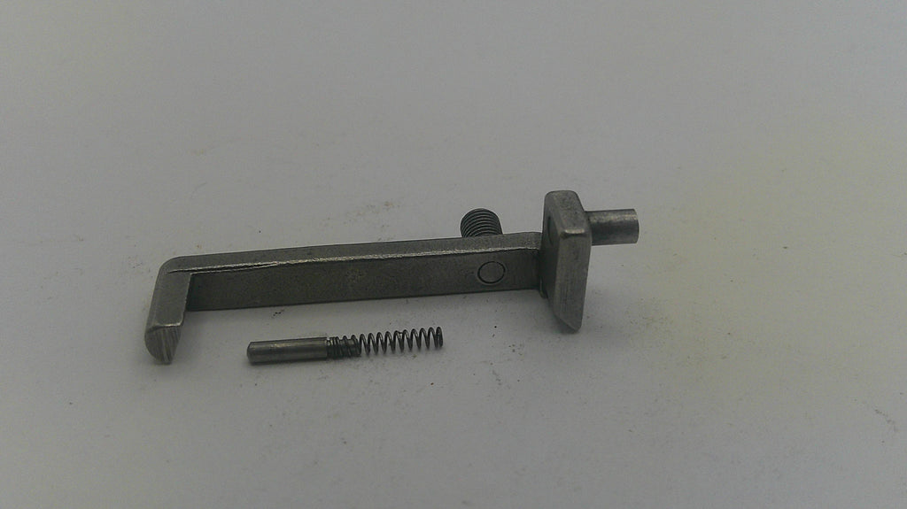 Metal tool and screw on a white background