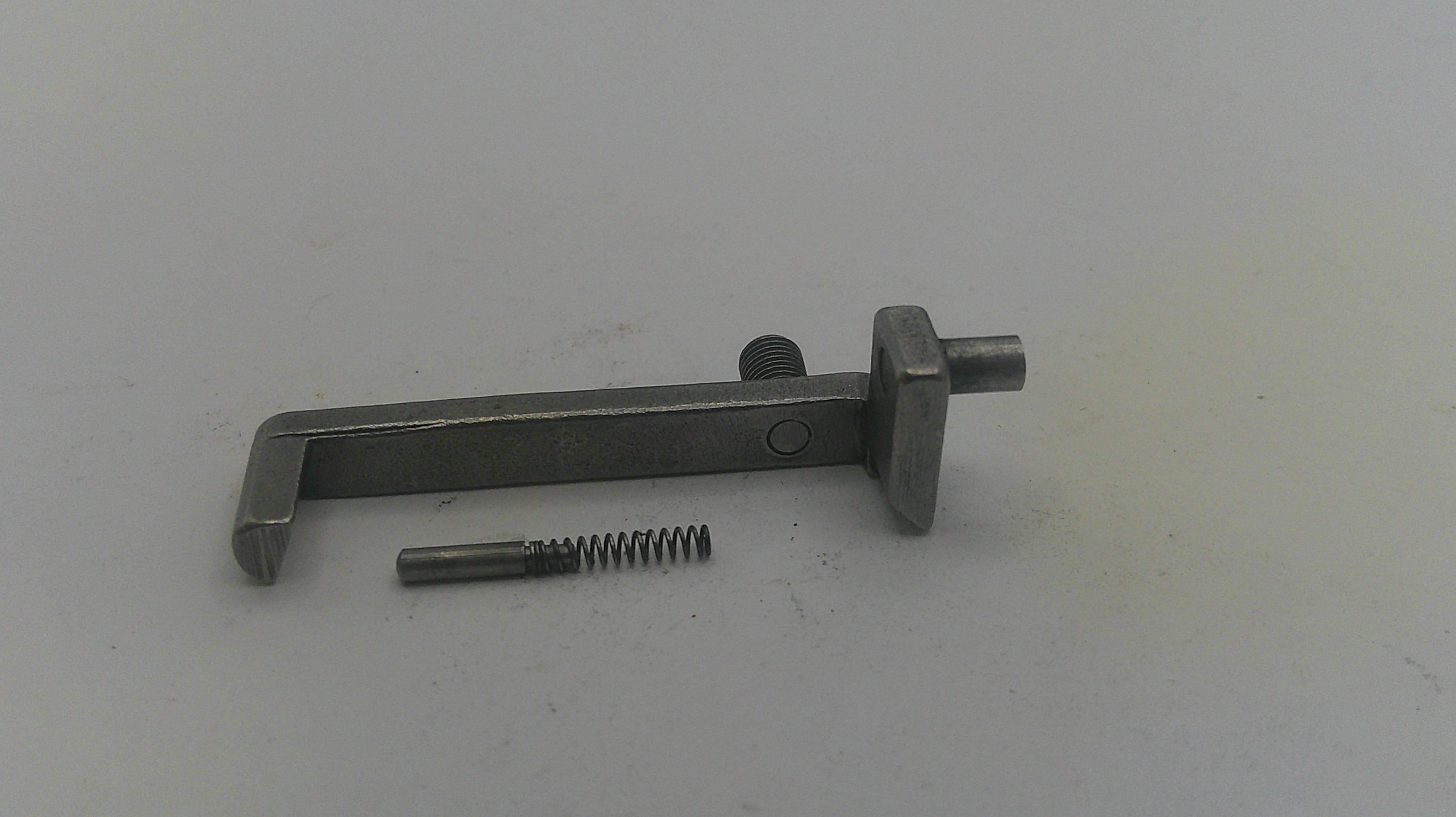 Metal tool and screw on a white background