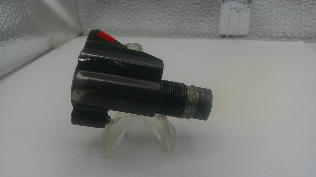 Black valve or similar mechanical component on a white background