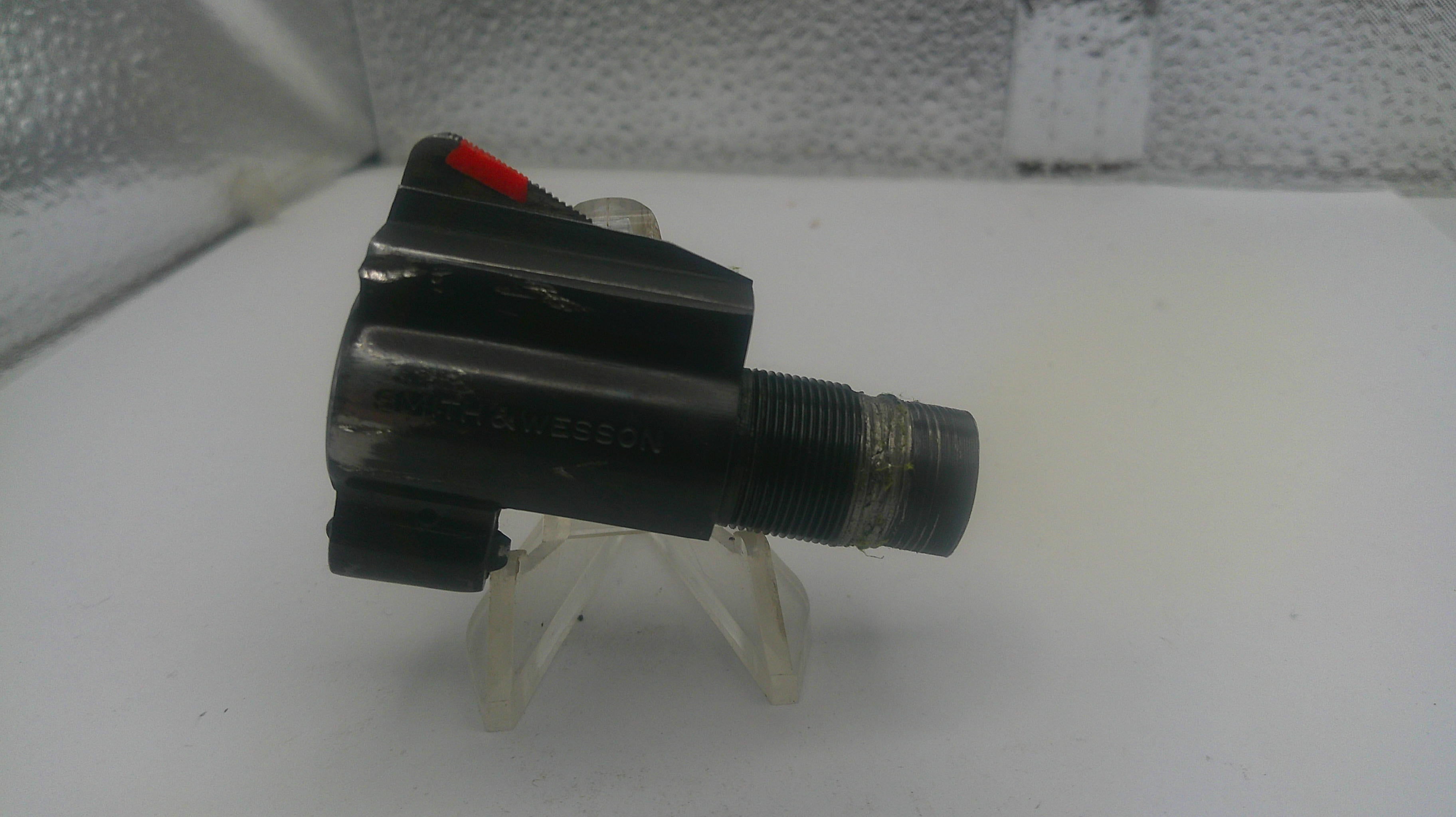Black valve or similar mechanical component on a white background