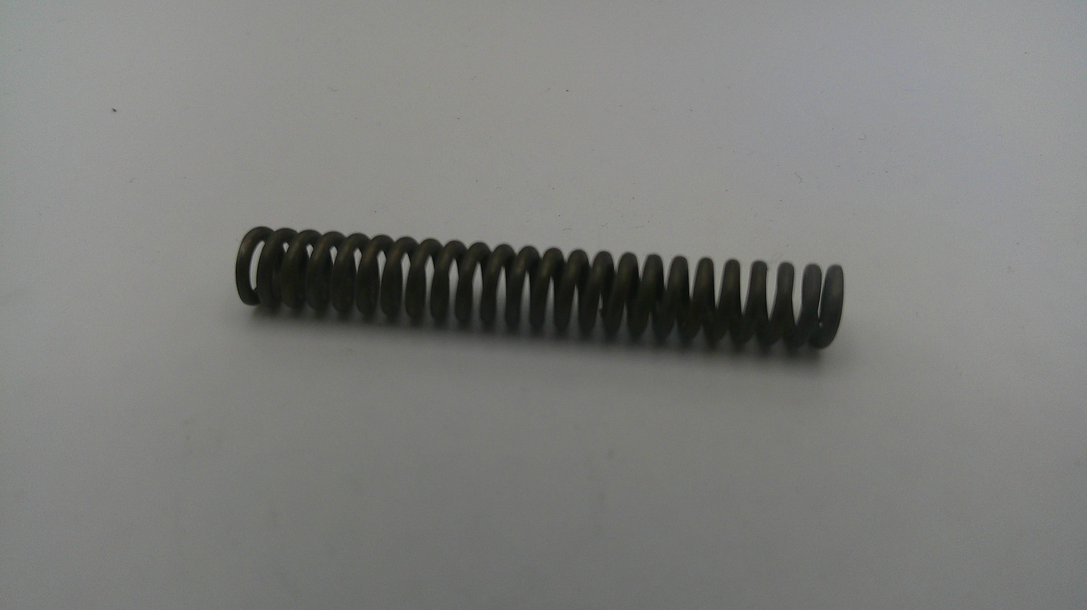 Coiled metal spring on a white background