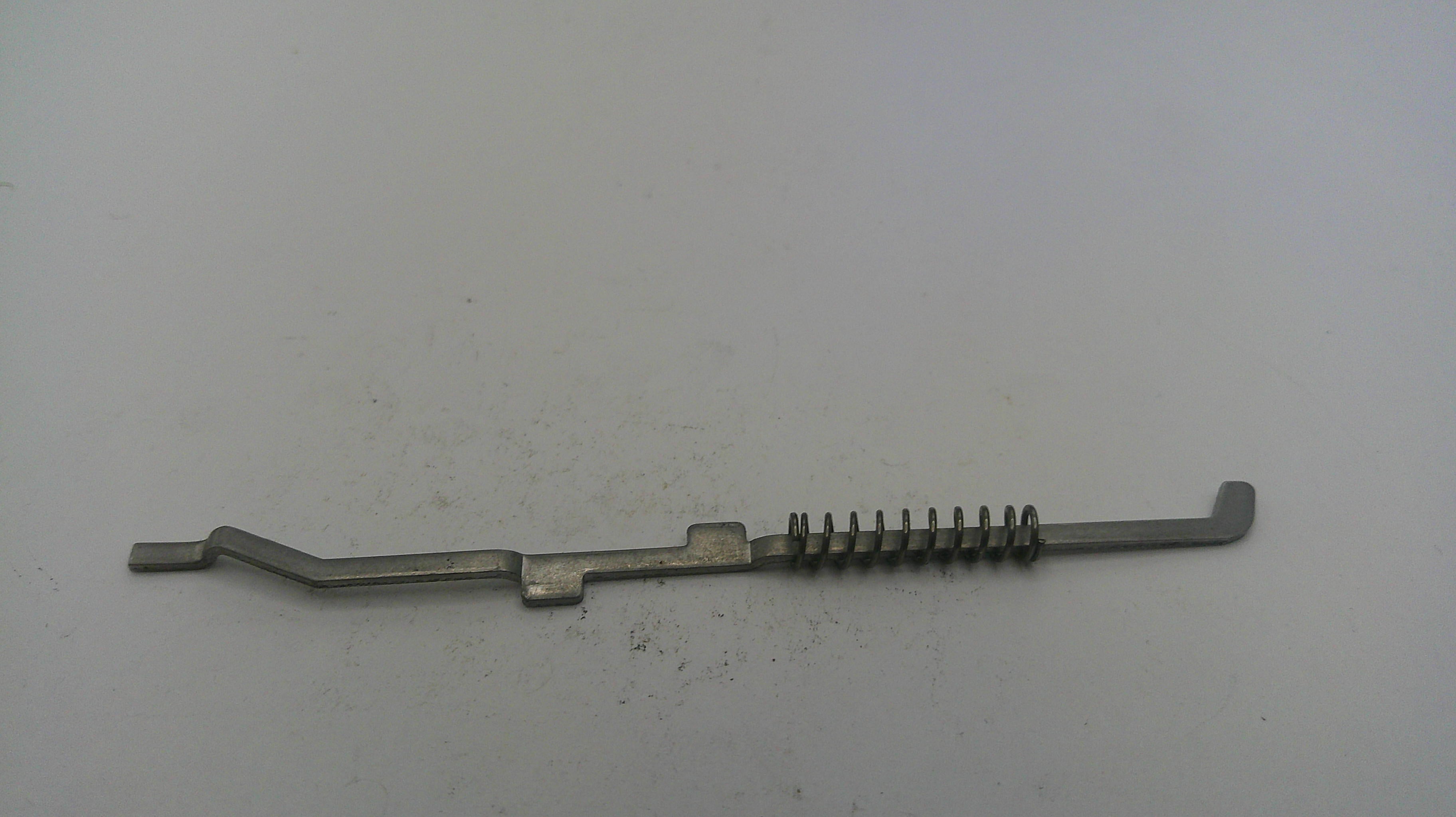 Metal tool with a spring on a white background