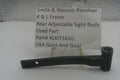 A used black metal part for a Smith & Wesson revolver rear adjustable sight body, displayed on a clear stand with a white label card showing part details.