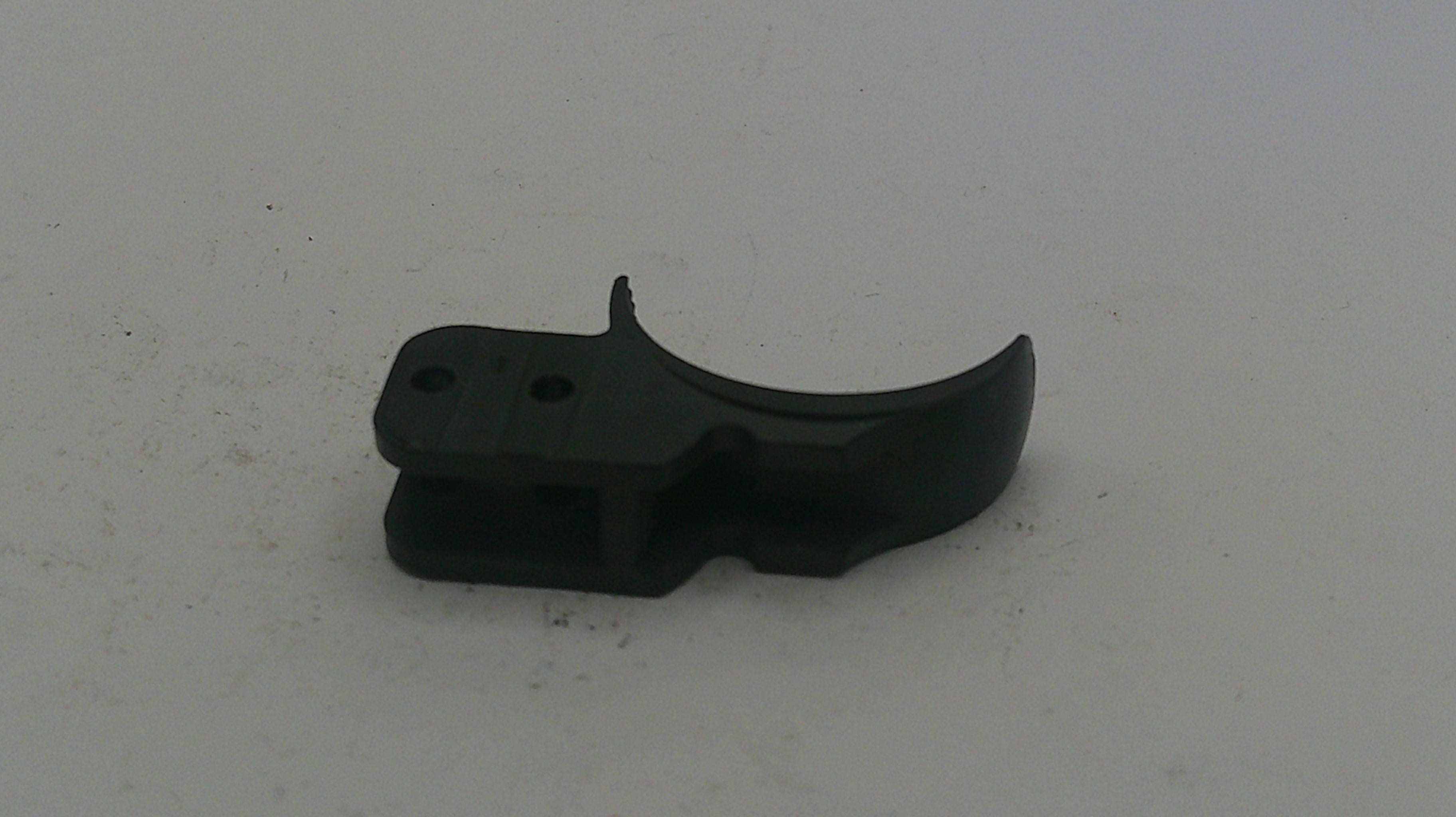Black plastic component on a white background