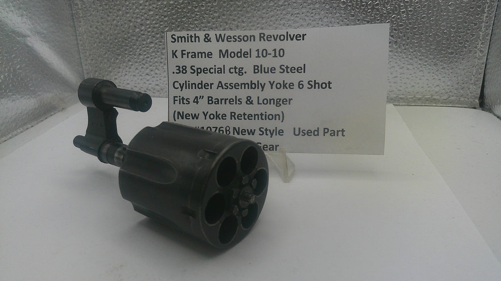 Smith & Wesson revolver cylinder assembly with a label on a reflective surface