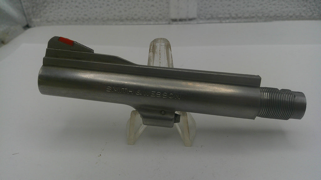 Metal component on a stand with a white background