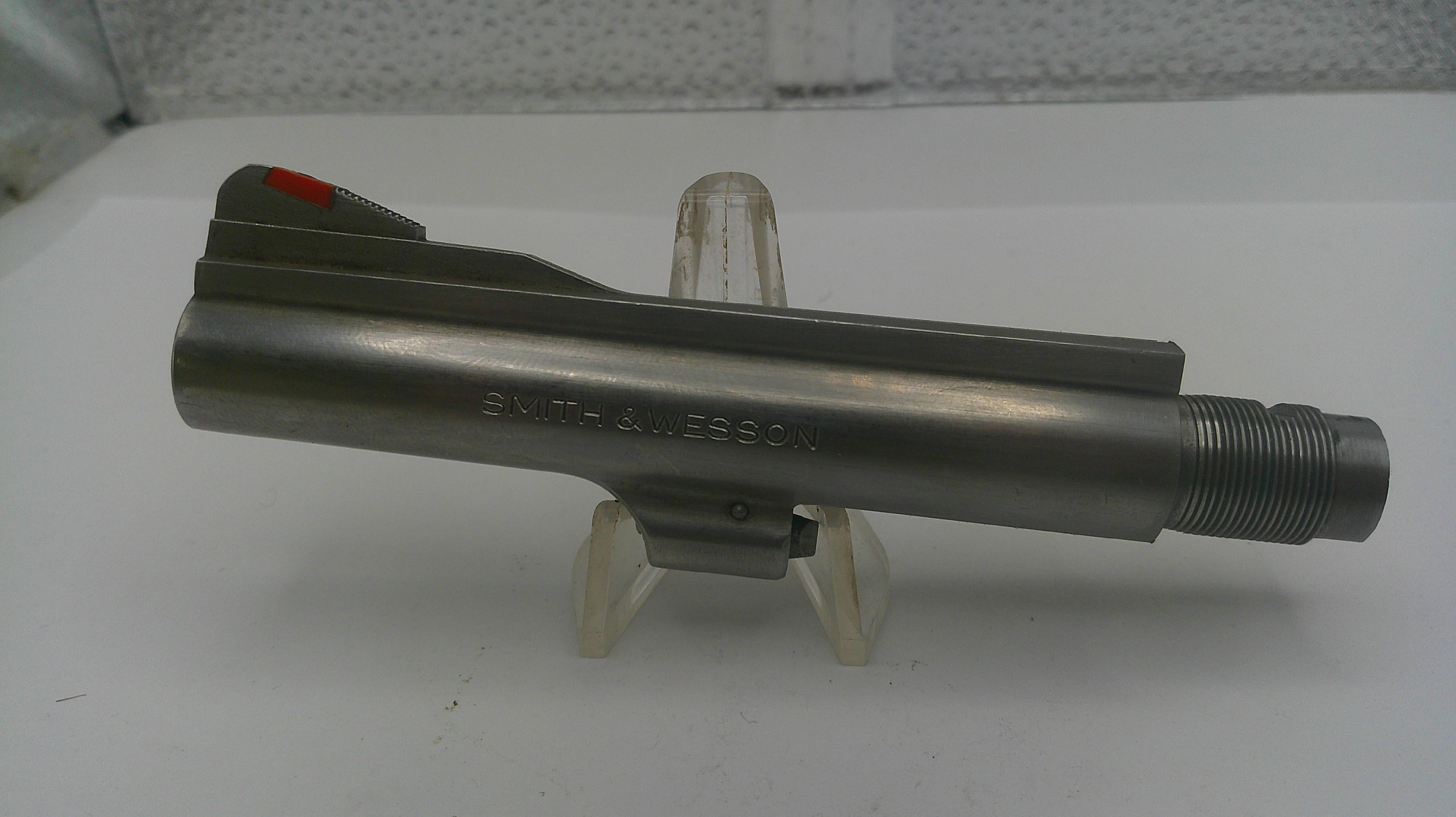 Metal component on a stand with a white background