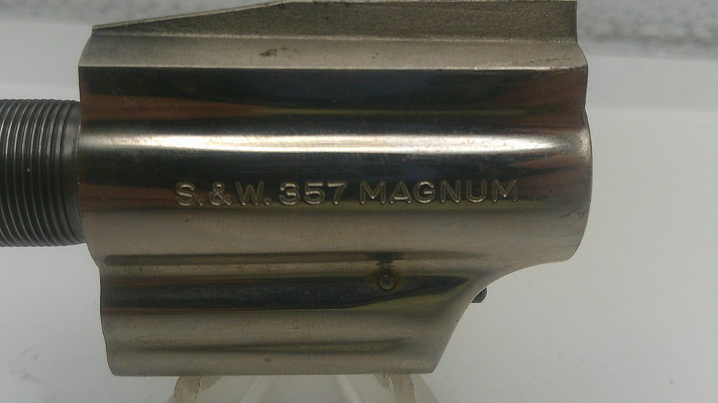 Metal component with 'S&W 357 Magnum' engraving on a white background
