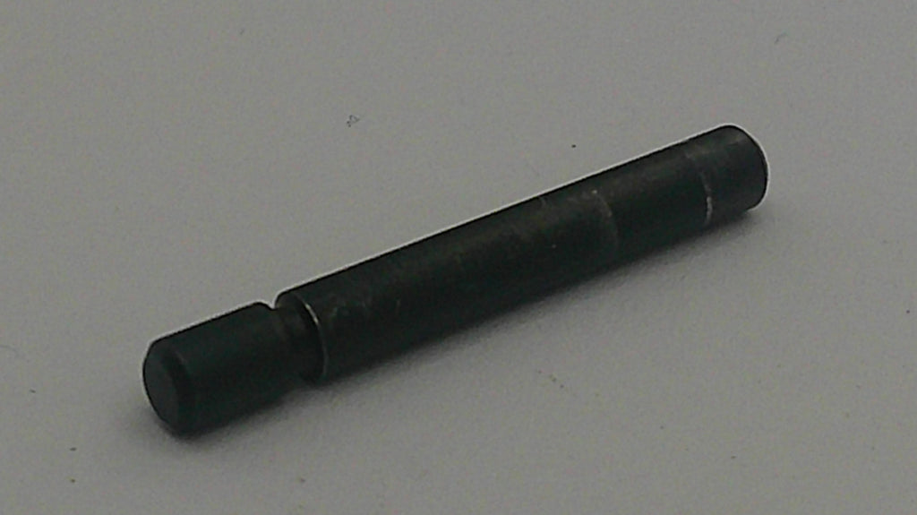 Black cylindrical object on a light gray background