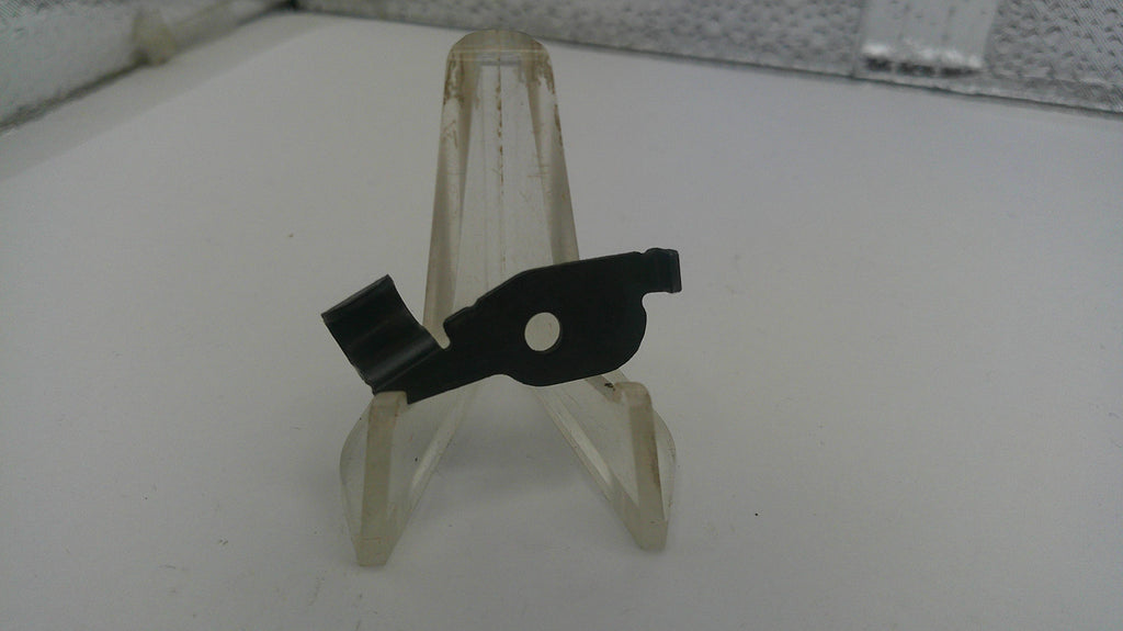 Small black and clear plastic stand on a white surface