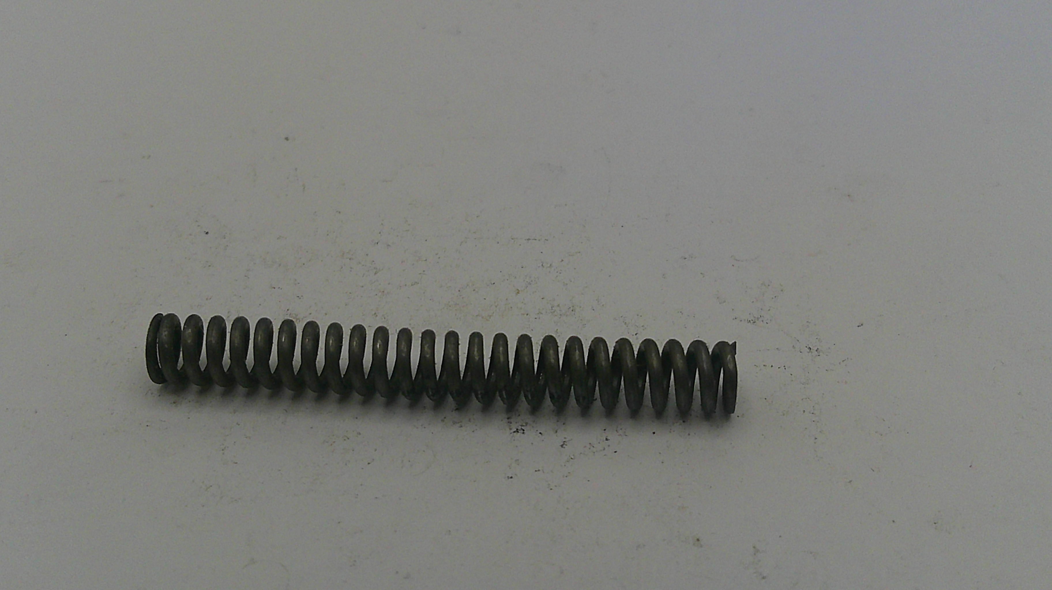 Coiled spring on a light gray background