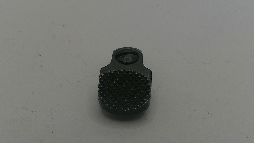 Black textured object on a light gray background