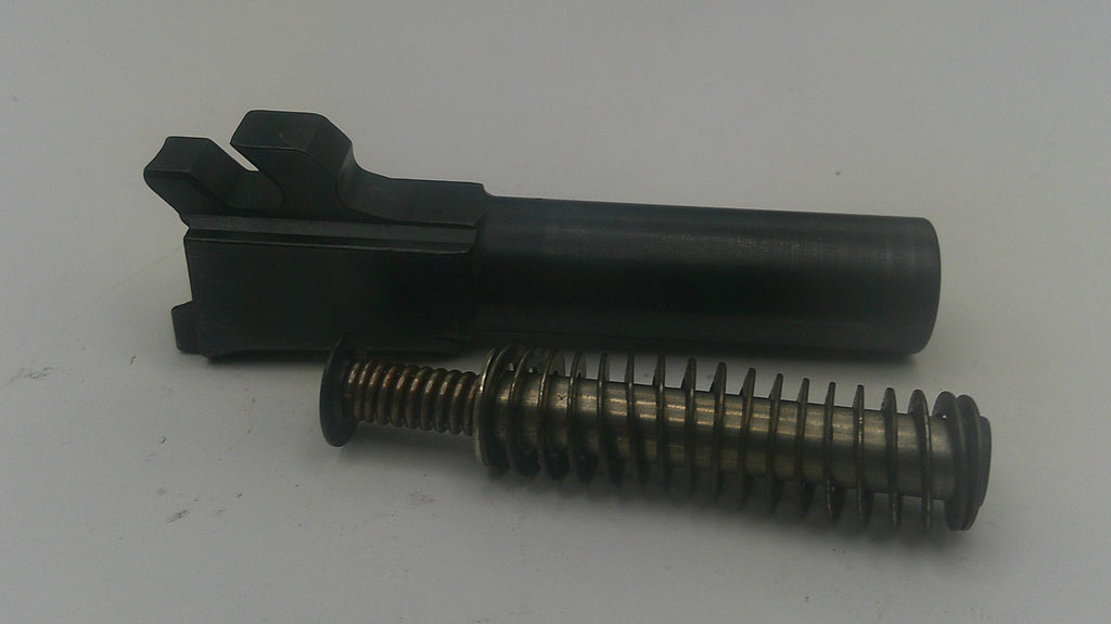 A black metal receiver or grip component with a threaded spring attached, photographed on a plain light gray background.