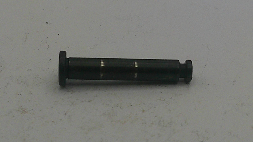 Black cylindrical object on a light gray background