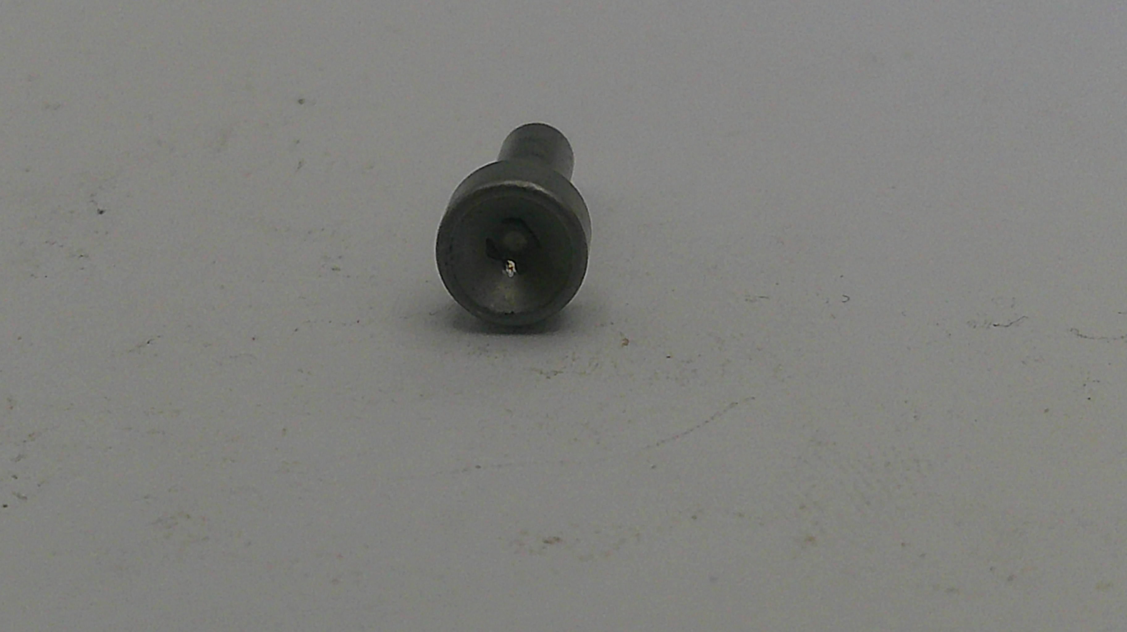 Metal screw on a light gray background