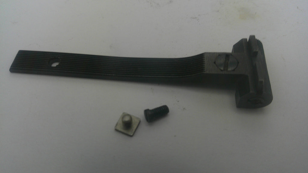 A black metal mounting bracket with a ribbed flat section and a mounting tab, shown with two small hardware components on a light gray surface.
