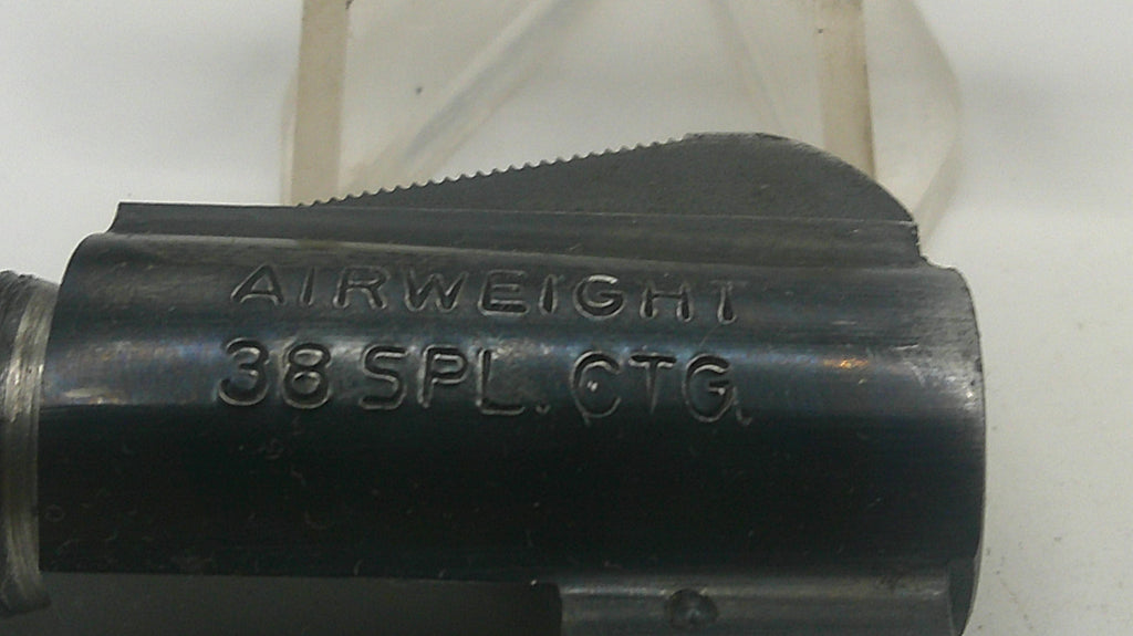 Black firearm barrel with 'AIRWEIGHT 38 SPL CTG' engraving on a white background