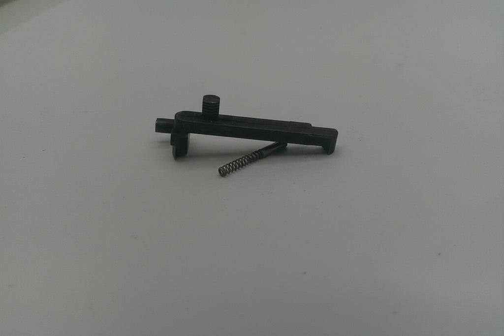 Black metal tool on a white surface