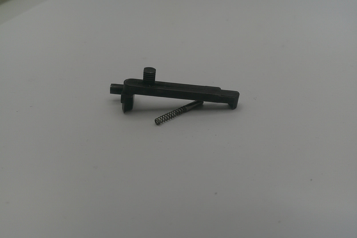 Black metal tool on a white surface