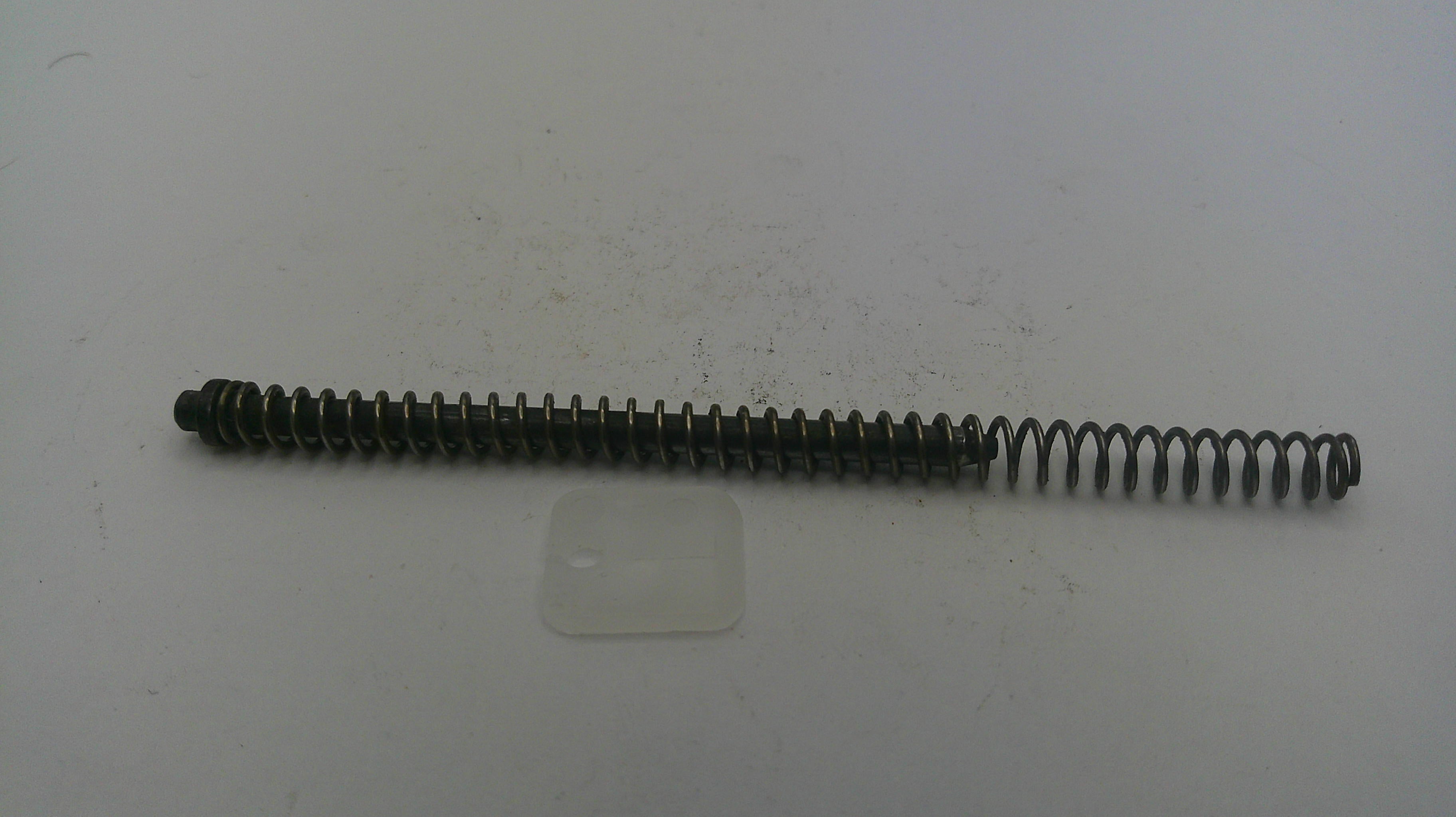 Long metal spring on a white background