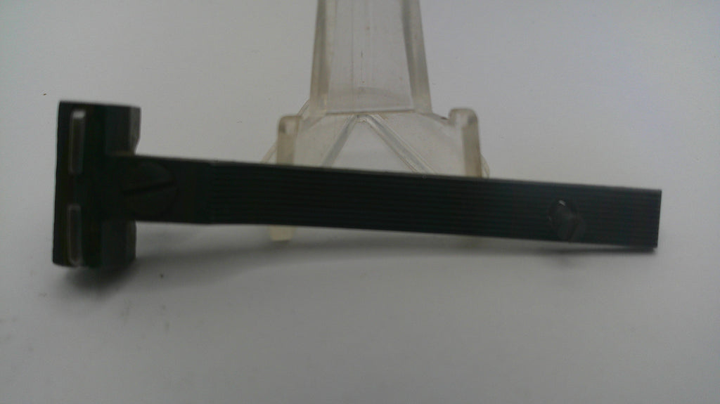 Black metal T-shaped tool on a white background