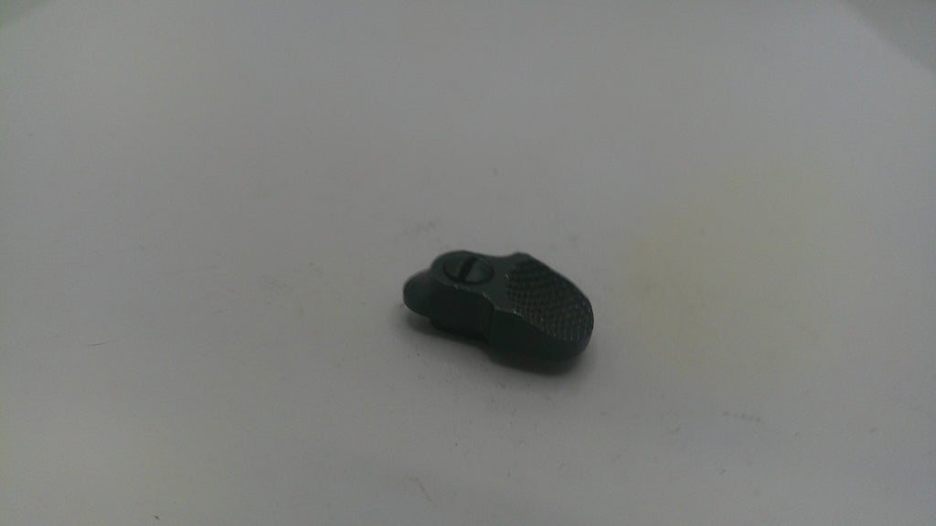 Small black object on a white surface