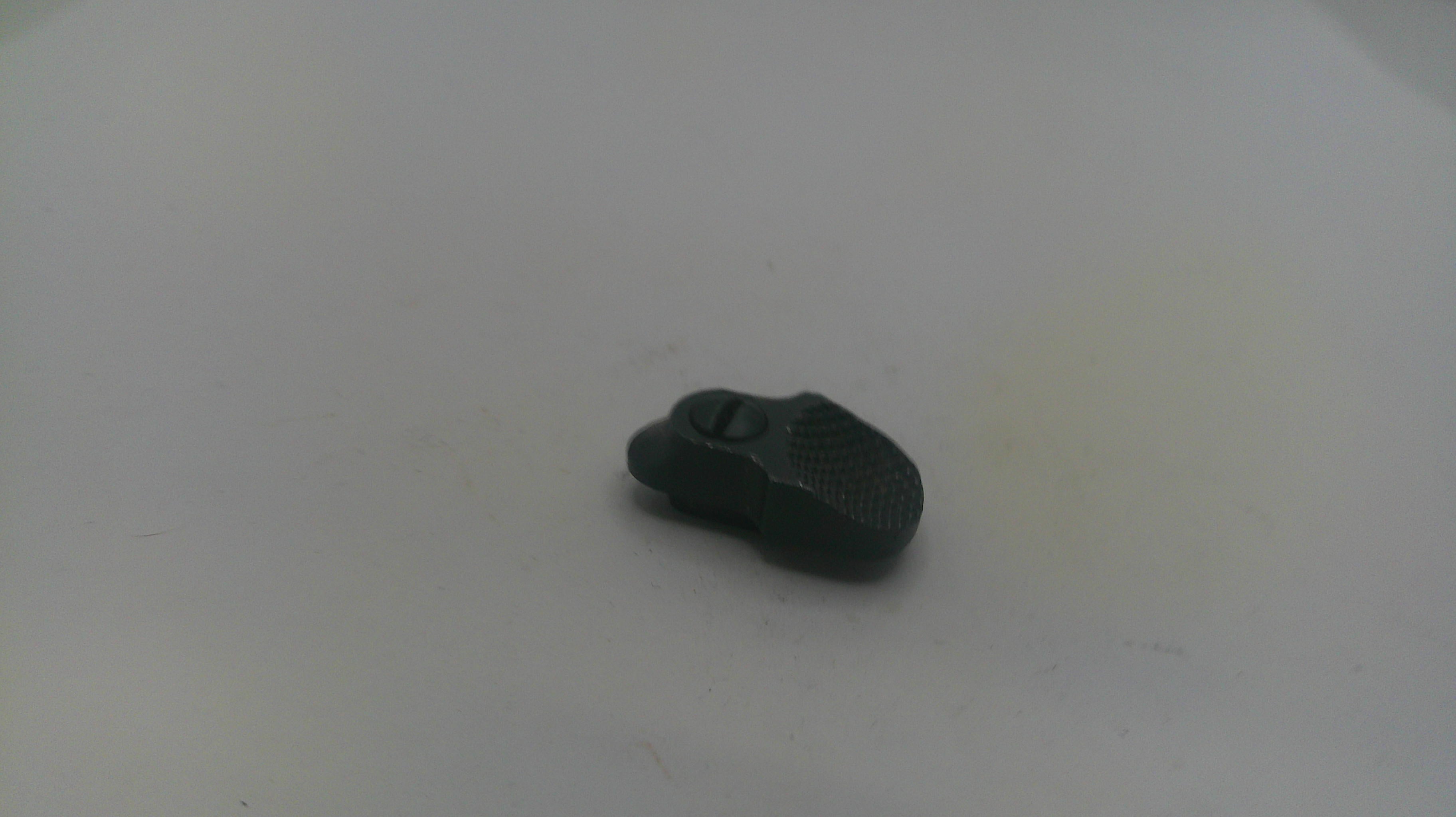 Small black object on a white surface