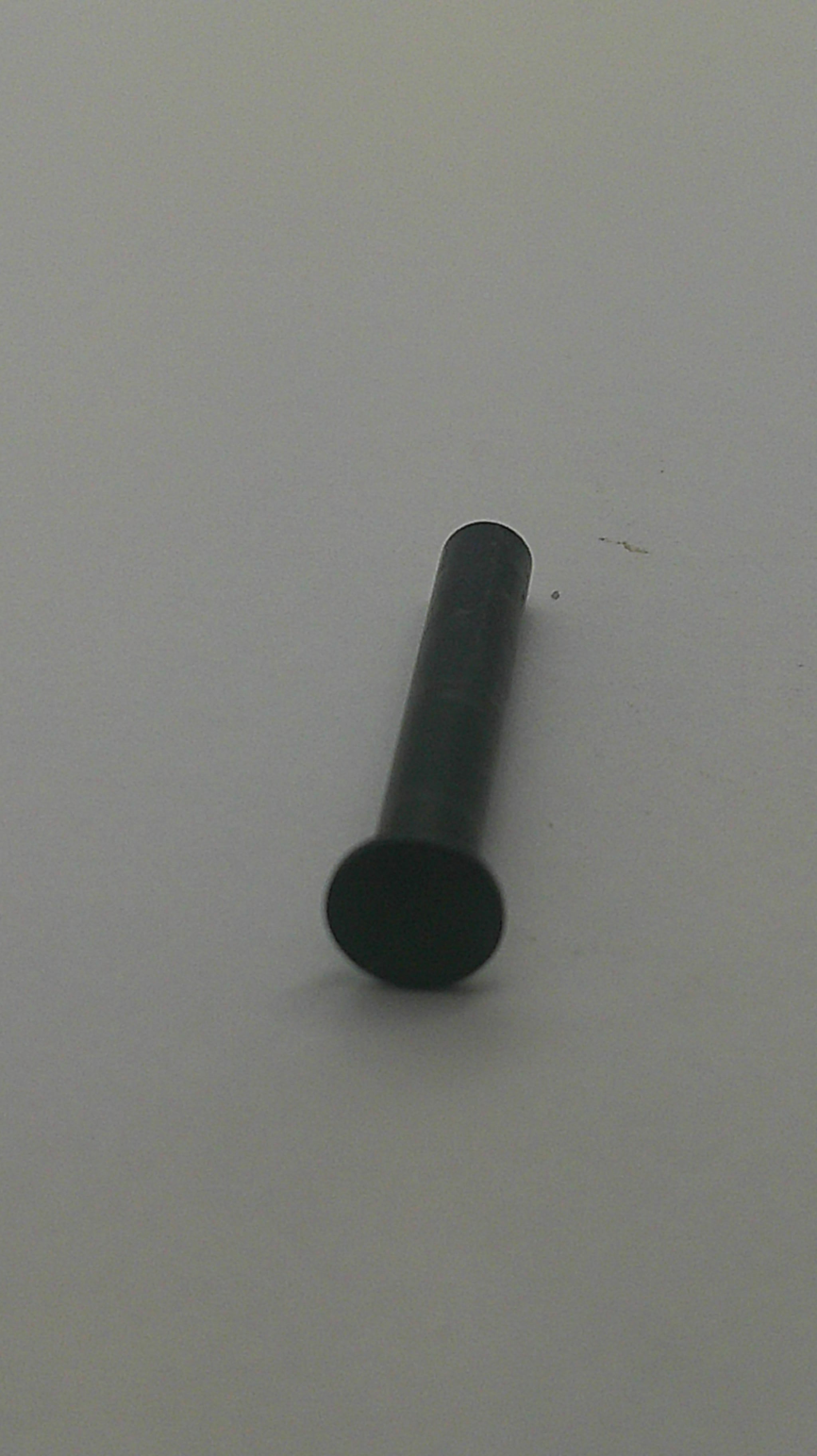 A small black cylindrical pin or fastener with a round head, shown on a plain light gray background.