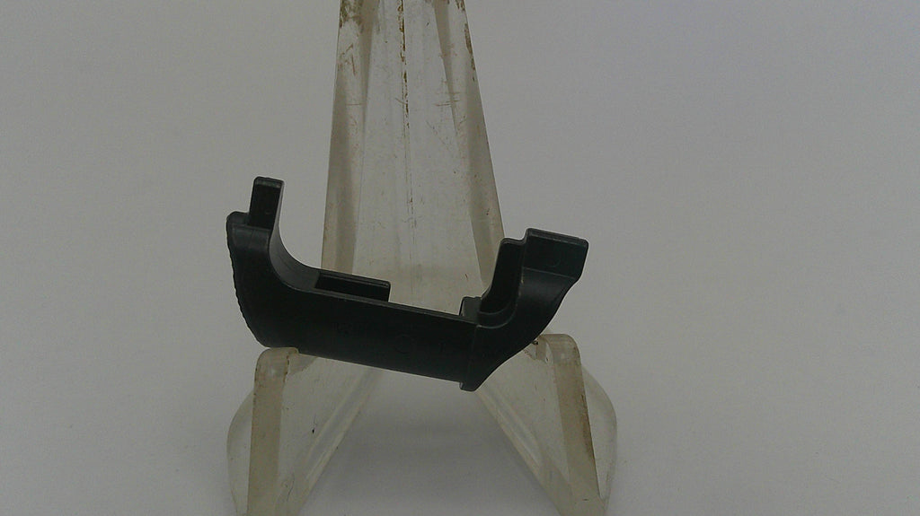 Black metal bracket on a white stand against a plain background