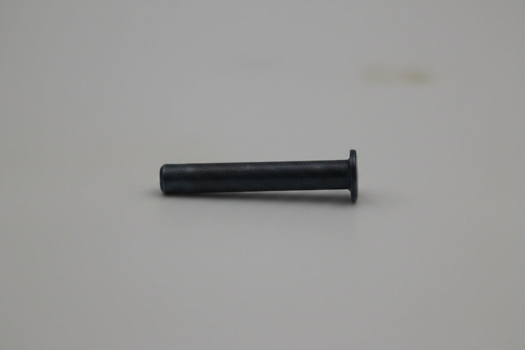 A small dark metal pin or bolt with a flat head, shown horizontally against a plain light gray background.