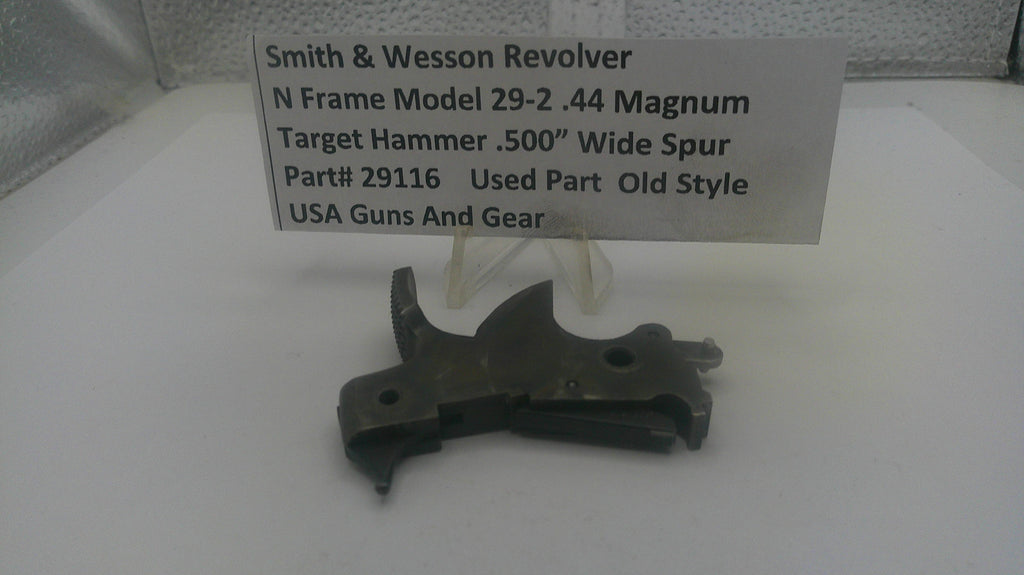 Smith & Wesson revolver part on a white surface with a label