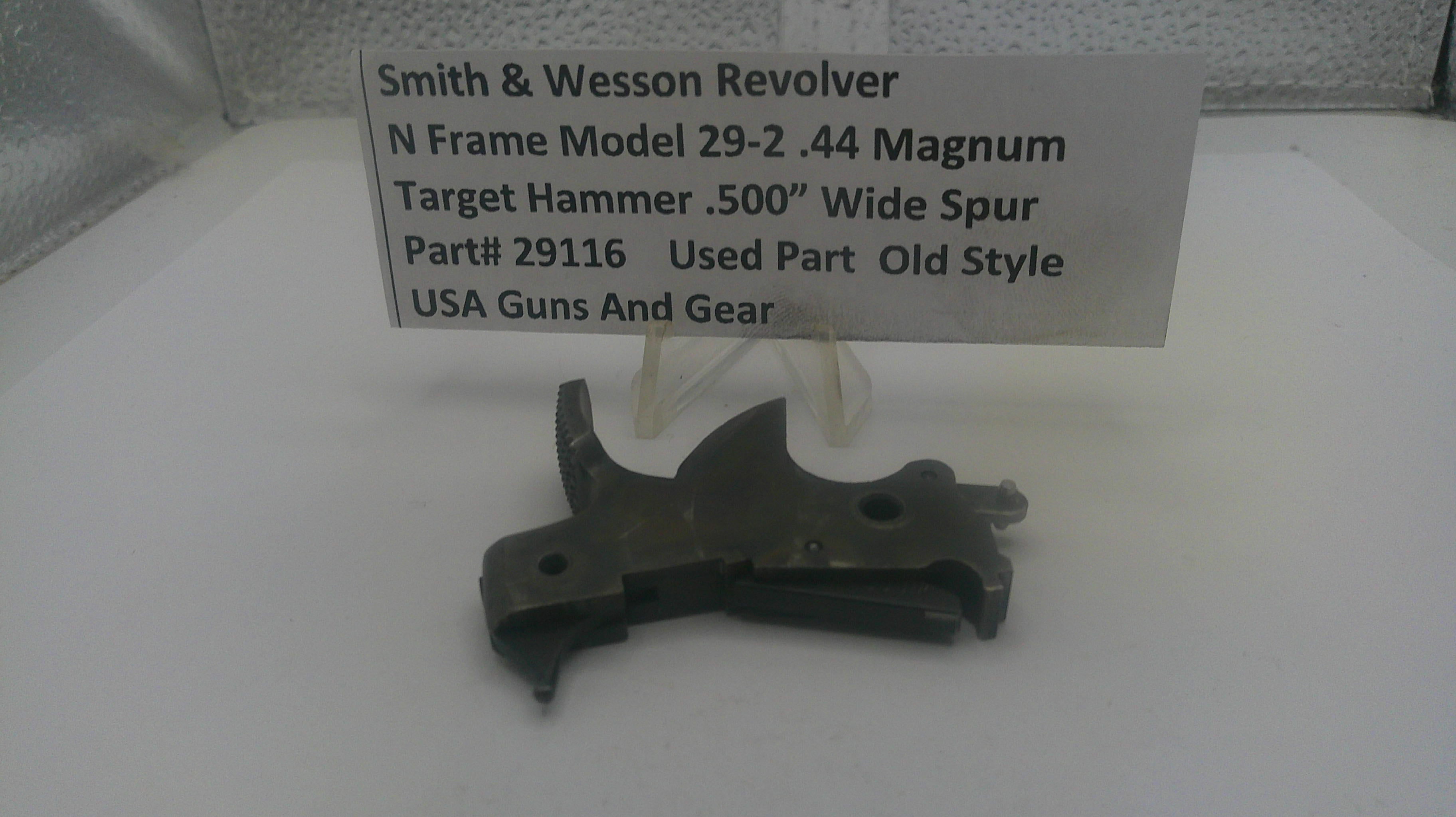 Smith & Wesson revolver part on a white surface with a label