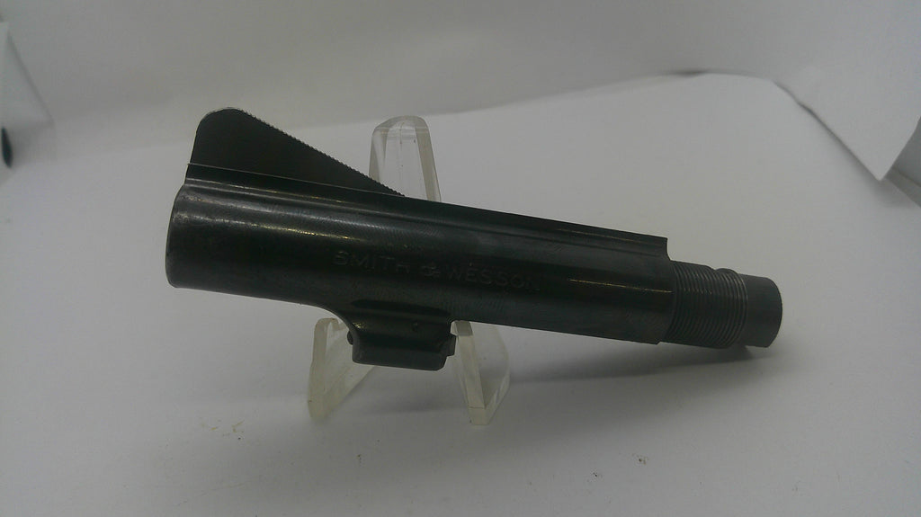 A black metal cylindrical component, likely a mechanical part or tool accessory, displayed on a clear plastic stand against a white background.