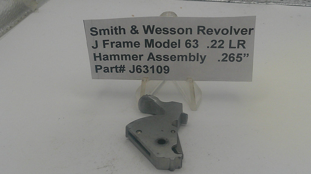 Smith & Wesson revolver hammer assembly with a label on a white background