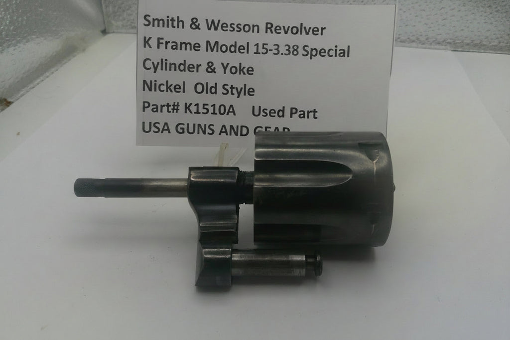 Smith & Wesson revolver K Frame Model 15 .38 Special cylinder and yoke on a white surface with a label.