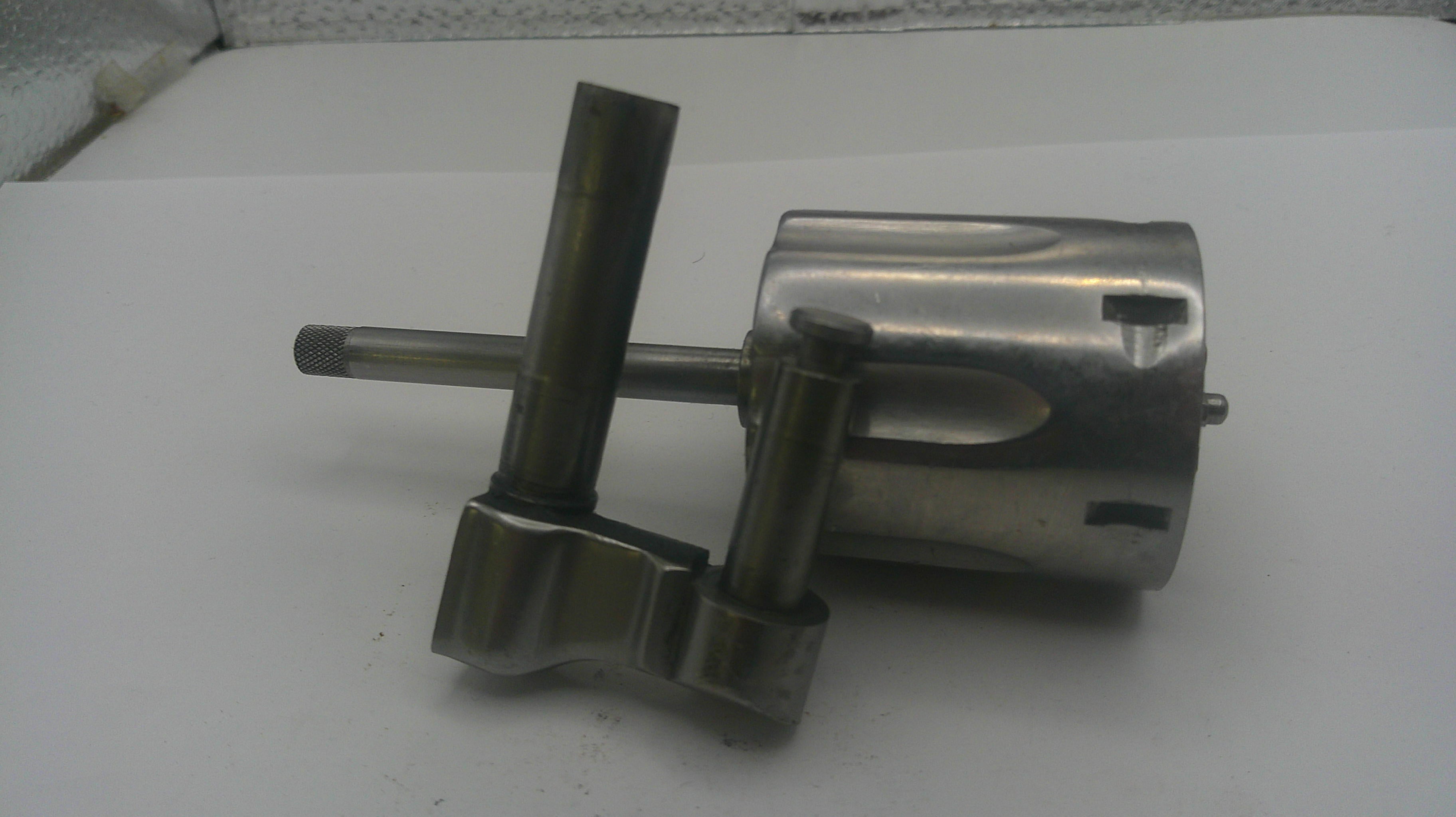 Metal mechanical component on a white surface