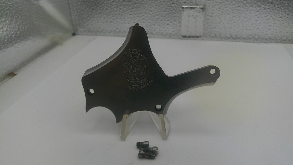 Black metal component with a logo on a white surface