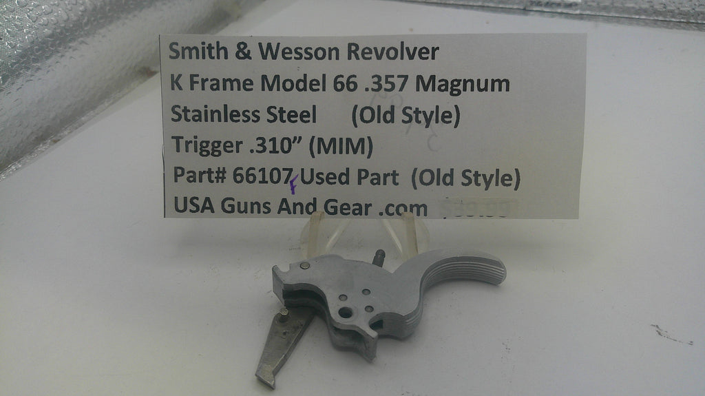 Smith & Wesson revolver trigger part with descriptive label on a white background