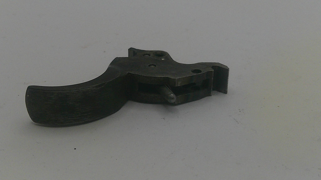 Black metal gun trigger on a white background
