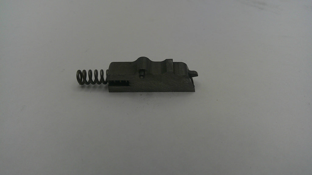 Black metal component with a spring on a white background