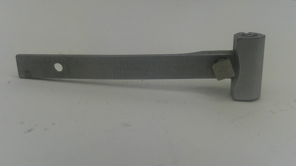 A metal hinge or bracket with a flat rectangular arm, a circular hole, and a cylindrical end piece, photographed on a plain light background.