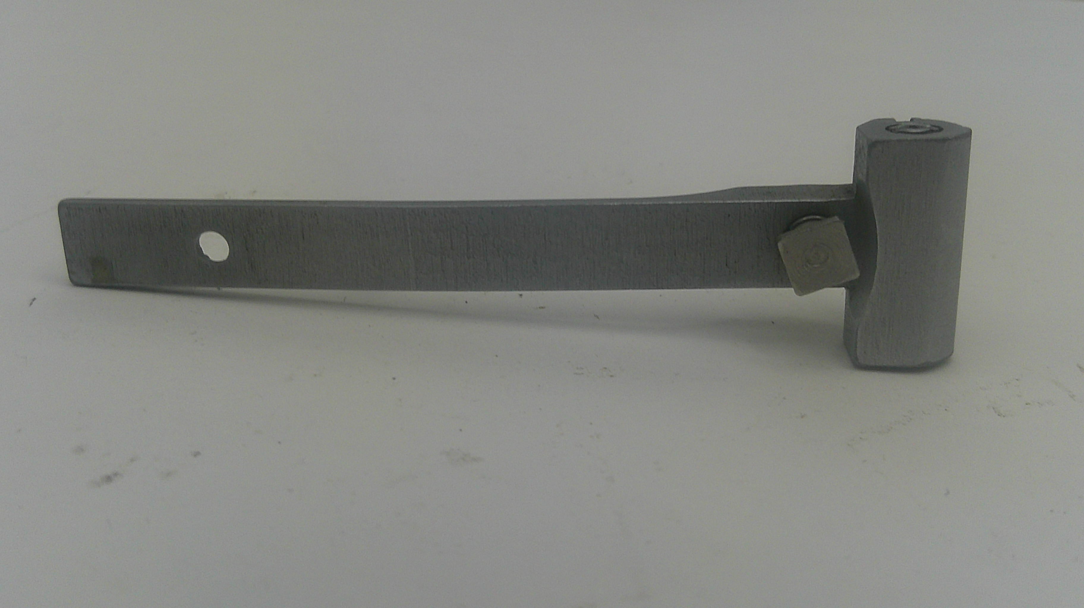 A metal hinge or bracket with a flat rectangular arm, a circular hole, and a cylindrical end piece, photographed on a plain light background.